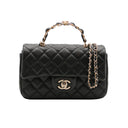 CHANEL – Mini sac classique avec poignée en agneau noir & métal doré