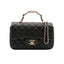 CHANEL – Mini sac classique avec poignée en agneau noir & métal doré