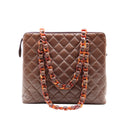 CHANEL – Sac Shopping vintage en cuir d’agneau chocolat (1994)