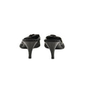 CHANEL – Mules à talons en résille noire et fleurs Camélia