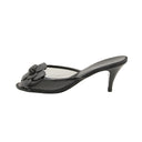 CHANEL – Mules à talons en résille noire et fleurs Camélia