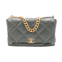 CHANEL – Sac Flap Maxi Matelassé Gris