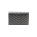 SAINT LAURENT – Pochette Cassandre en cuir grainé noir