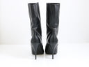 Black leather heeled boots with gold-tone hardware