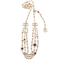 CHANEL – Gold-tone metal, pearl, and resin belt/necklace A20